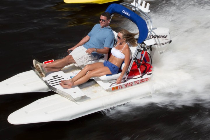 a person riding on the back of a boat